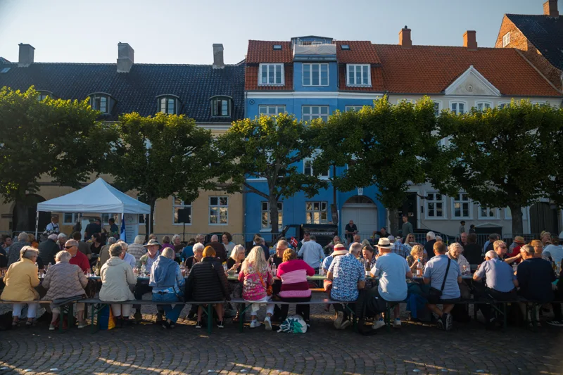 People gathered around a long table in Helsingør.